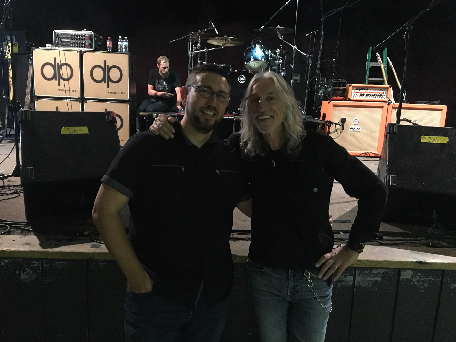 Miguel with Gerry Gaskill in front of a stage.