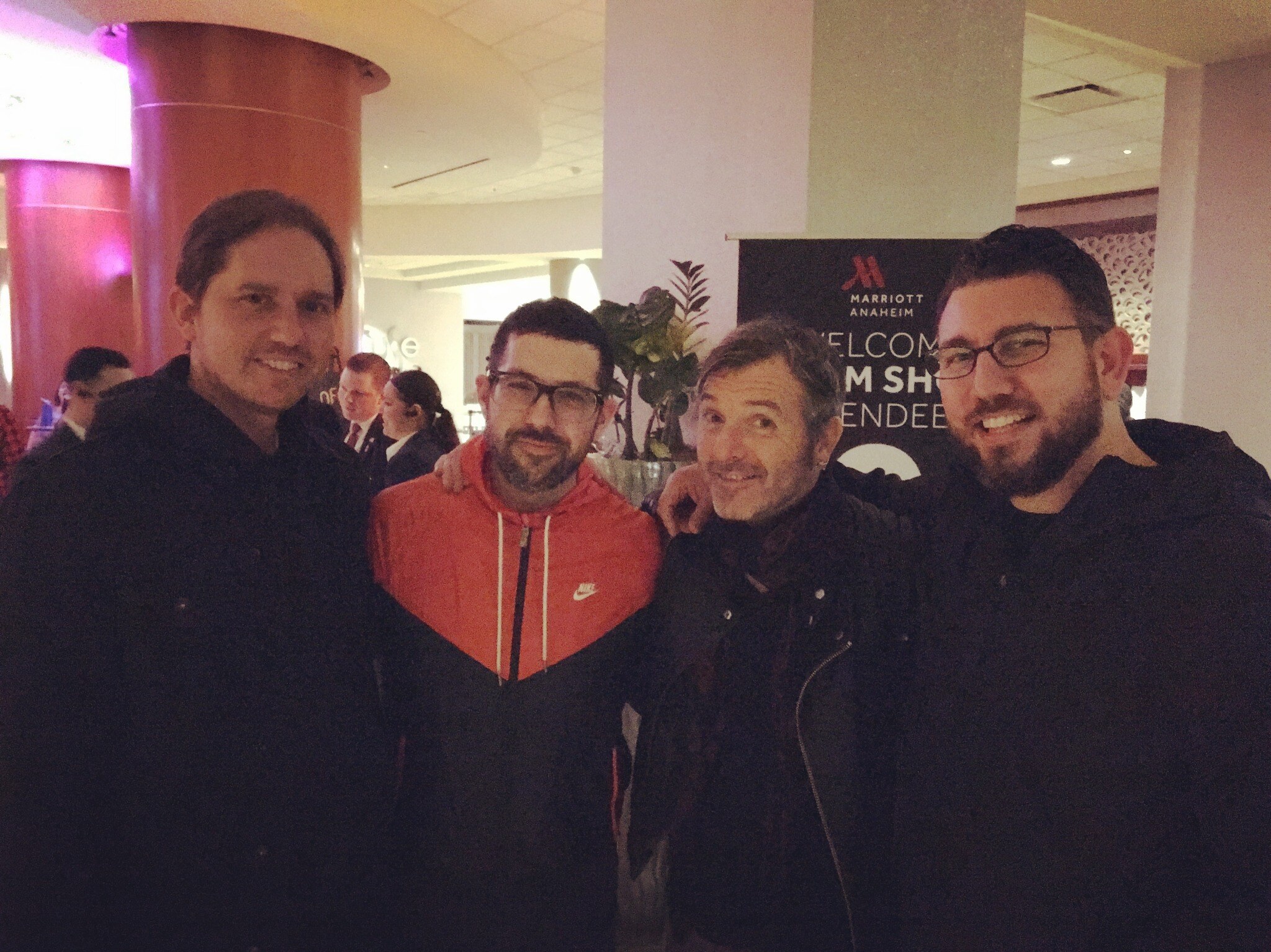 Miguel with Mike Dawson, Mark Guiliana, and Ash Soan in a hotel lobby.